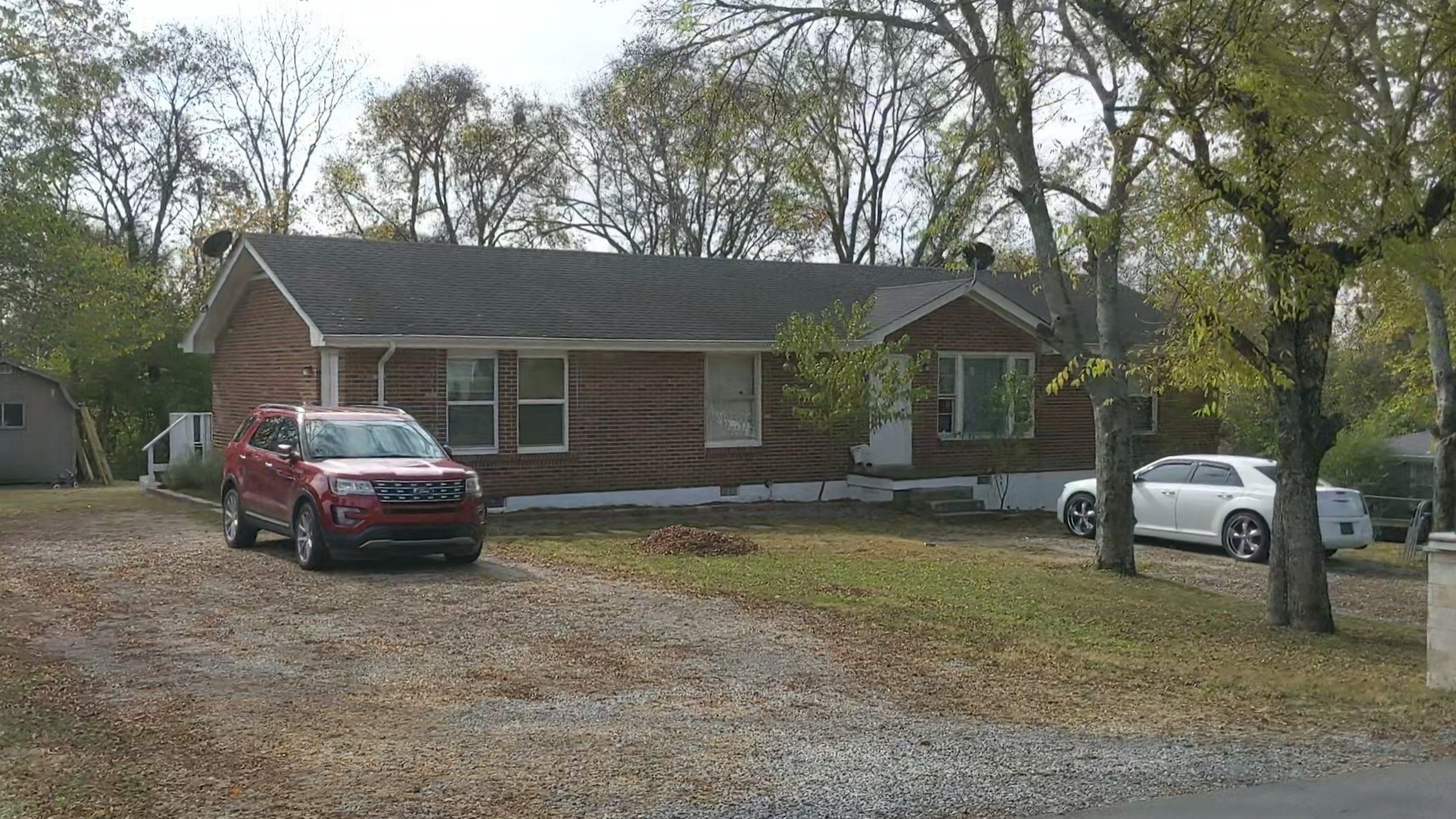 700 Blackstone Avenue Madison, TN 37115 - Photo 1 of 15 a front view of a house with a garden and trees