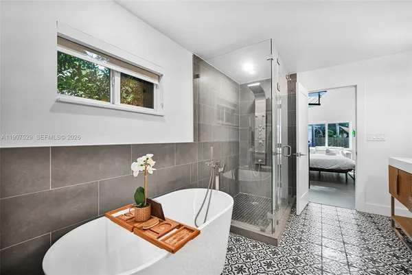 a bedroom with a bed and window