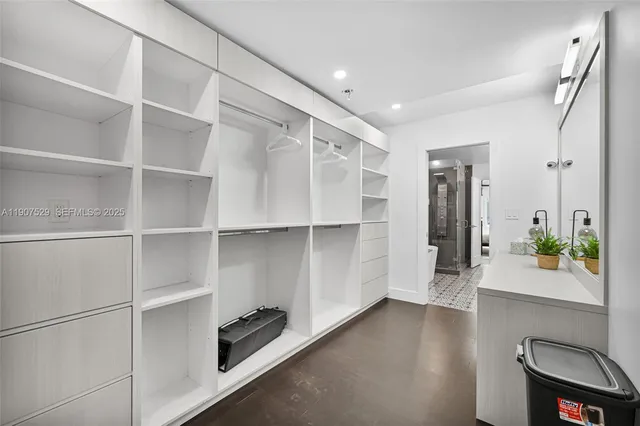 a bedroom with a bed and a night stand