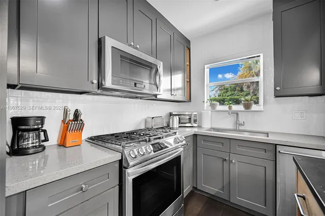 a view of an empty room and a window