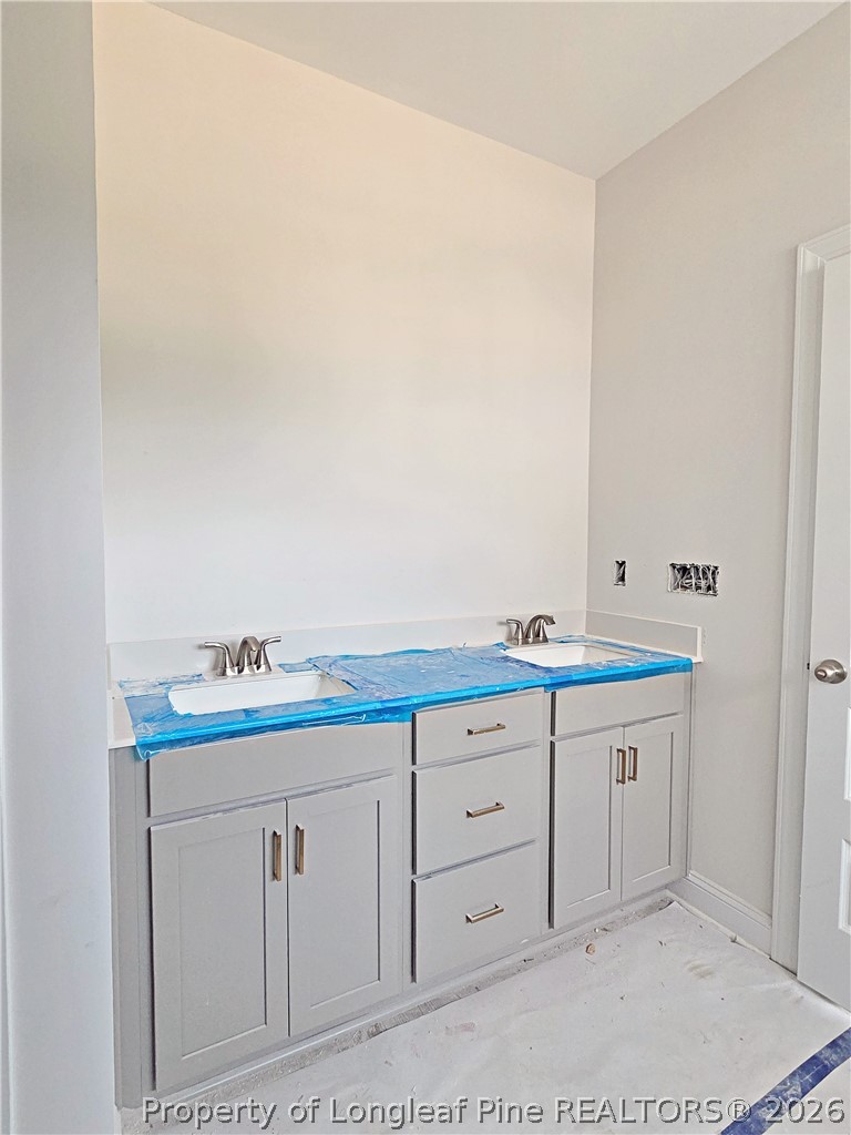 2678 Norrington Road Lillington, NC 27546 - Photo 17 of 31 a bathroom with a sink and a mirror