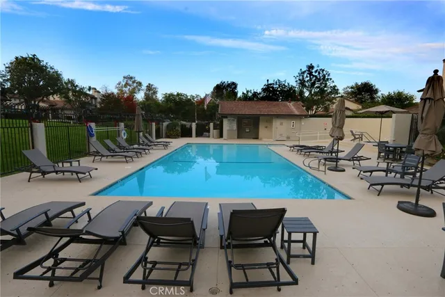 a view of a swimming pool with chairs