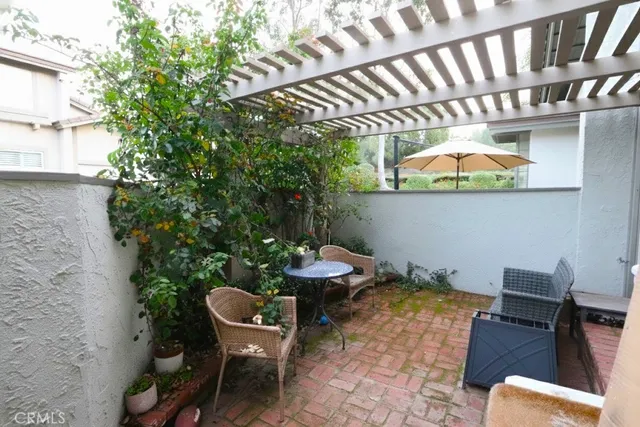 a view of a chairs and table in a patio