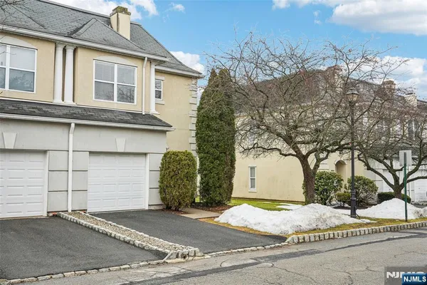 a kitchen with stainless steel appliances kitchen island granite countertop a refrigerator and a stove top oven