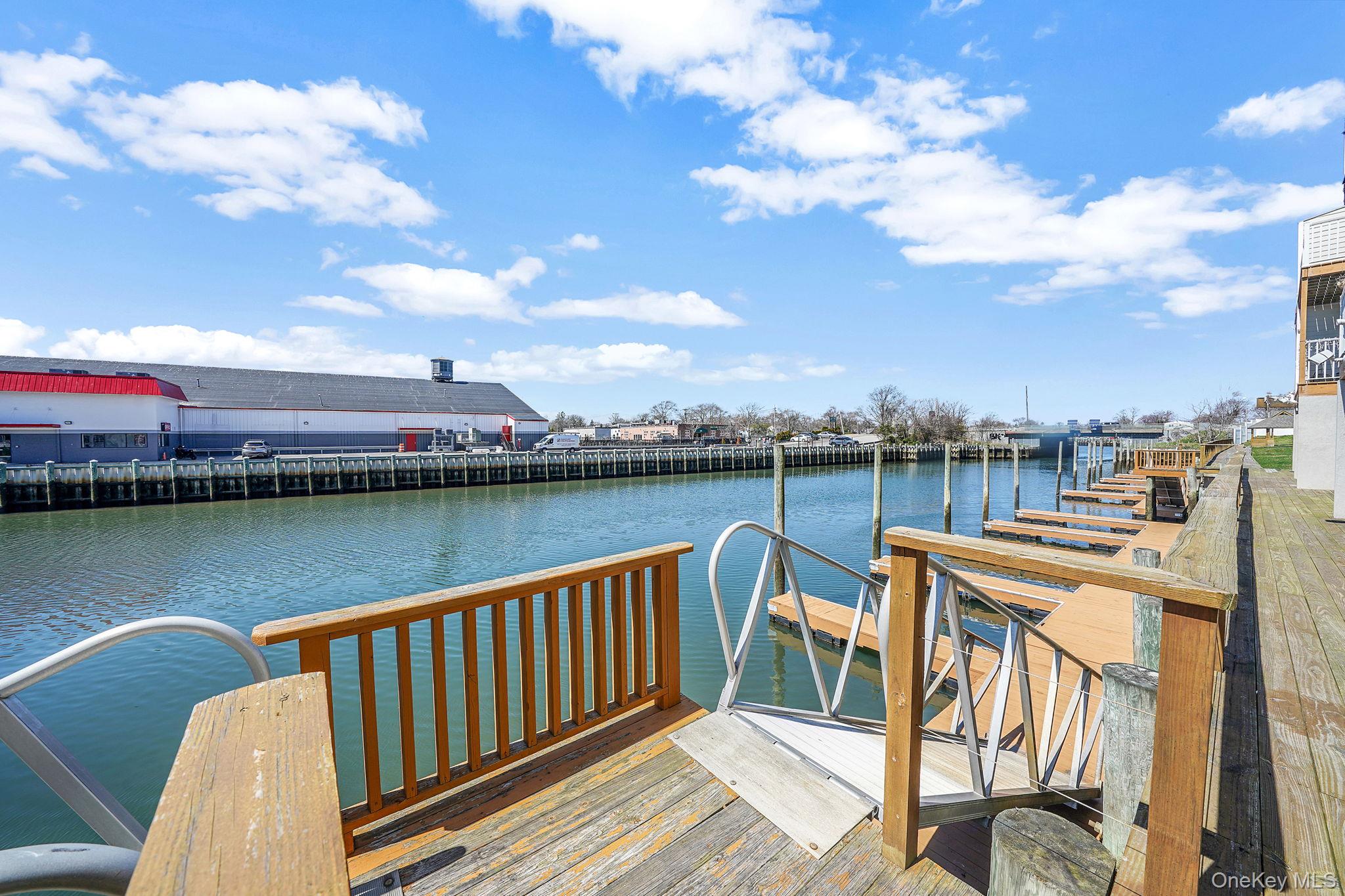531 Ray Street, Unit 10 Freeport, NY 11520 - Photo 27 of 32 a view of a lake with a terrace