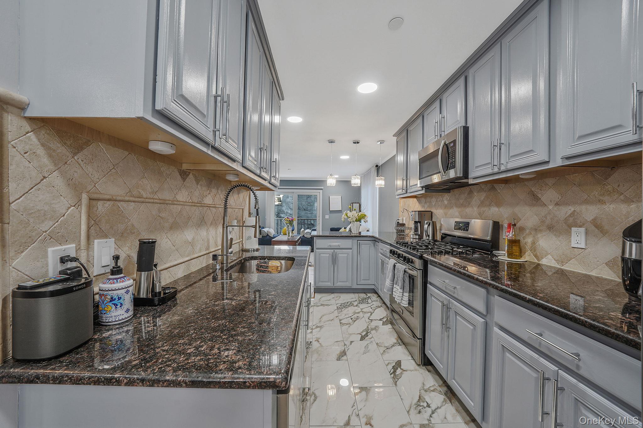 531 Ray Street, Unit 10 Freeport, NY 11520 - Photo 3 of 32 a kitchen with lots of counter top space and appliances