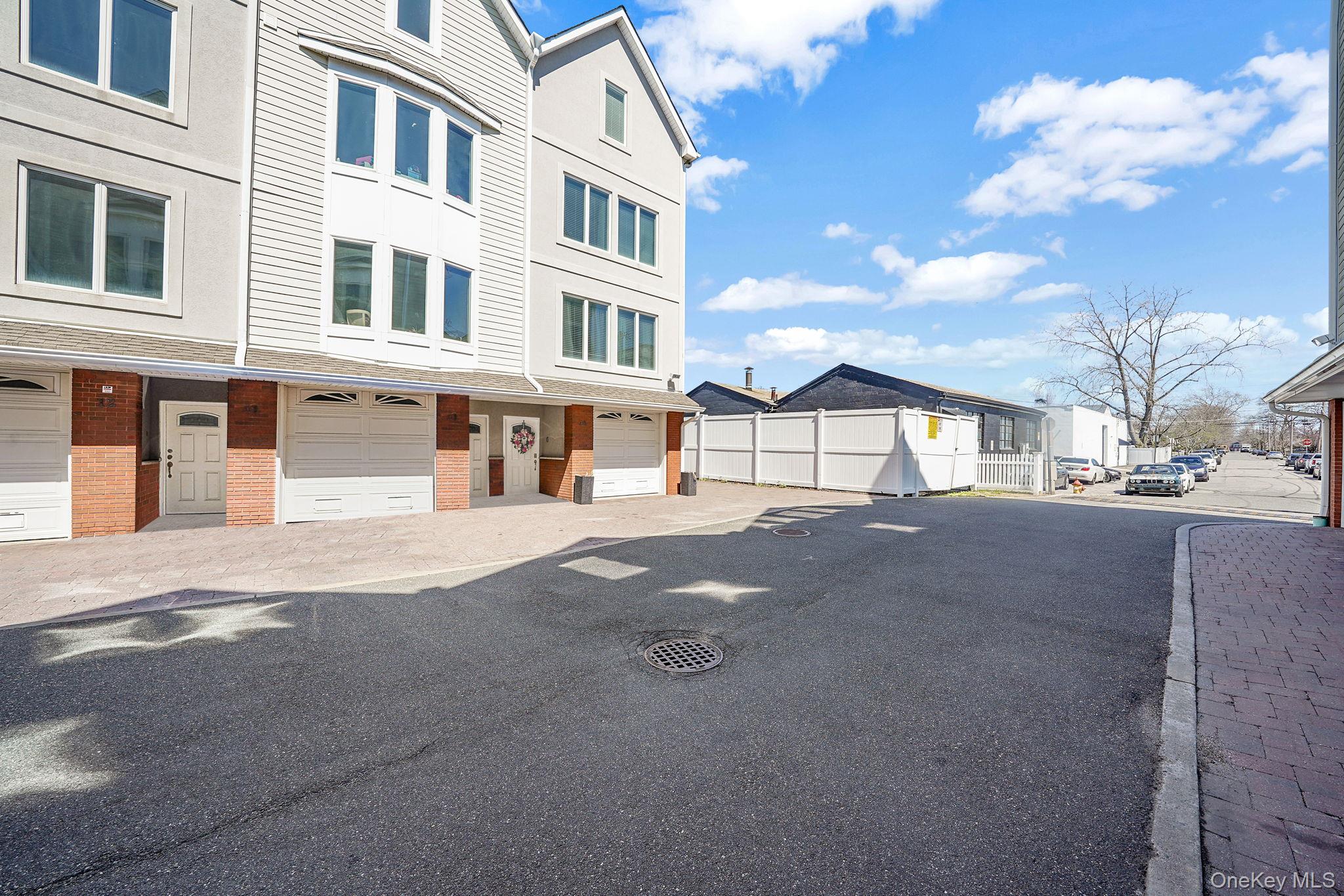 531 Ray Street, Unit 10 Freeport, NY 11520 - Photo 31 of 32 a view of a street with houses