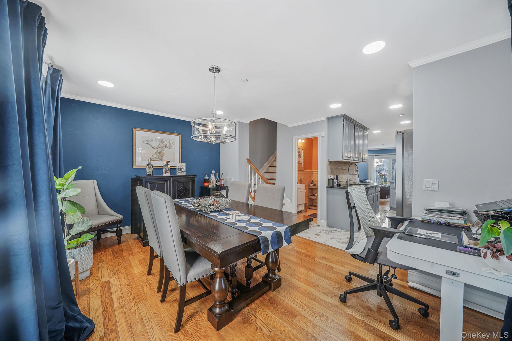 531 Ray Street, Unit 10 Freeport, NY 11520 - Photo 8 of 32 a view of a dining room with furniture and a chandelier