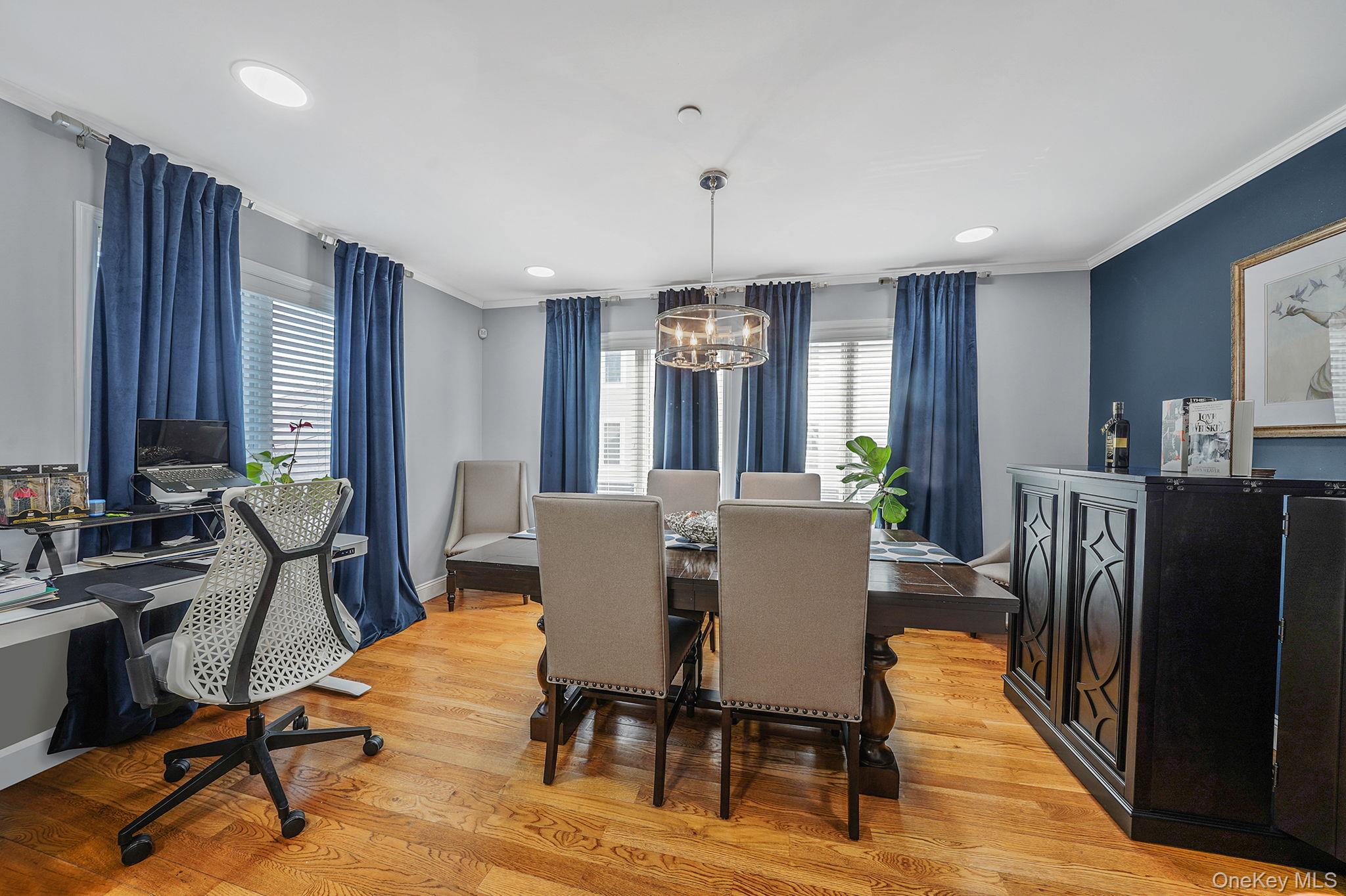 531 Ray Street, Unit 10 Freeport, NY 11520 - Photo 9 of 32 a view of a dining room with furniture window and wooden floor