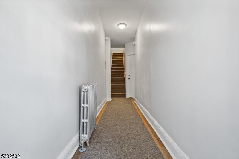60 2nd Street South Orange, NJ 07079 - Photo 18 of 19 a view of a hallway with wooden staircase