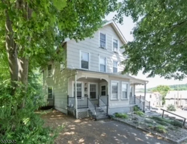 front view of a house with a garden