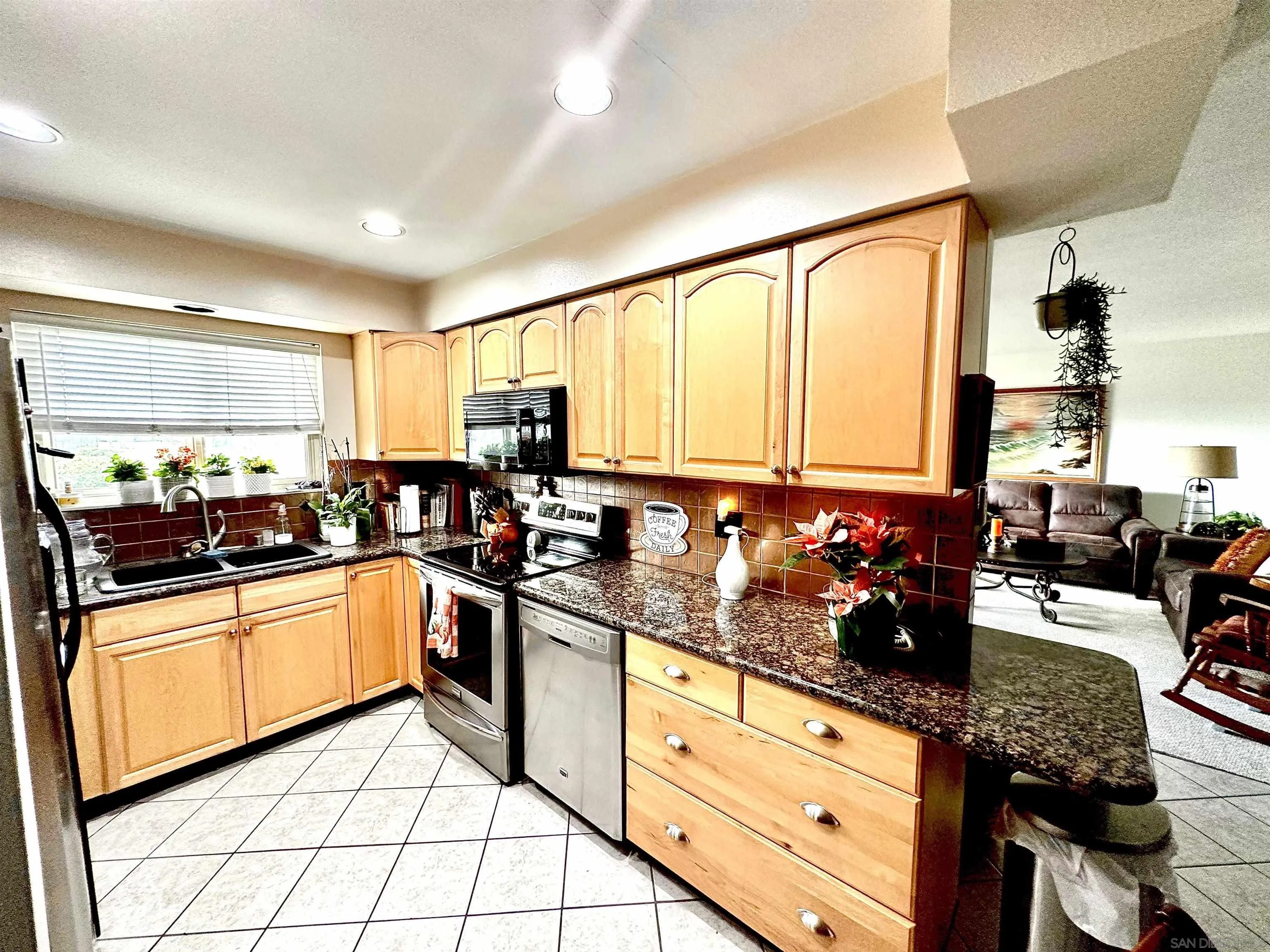 3684 Bartlett Avenue Oceanside, CA 92057 - Photo 18 of 38 a kitchen with granite countertop lots of counter top space