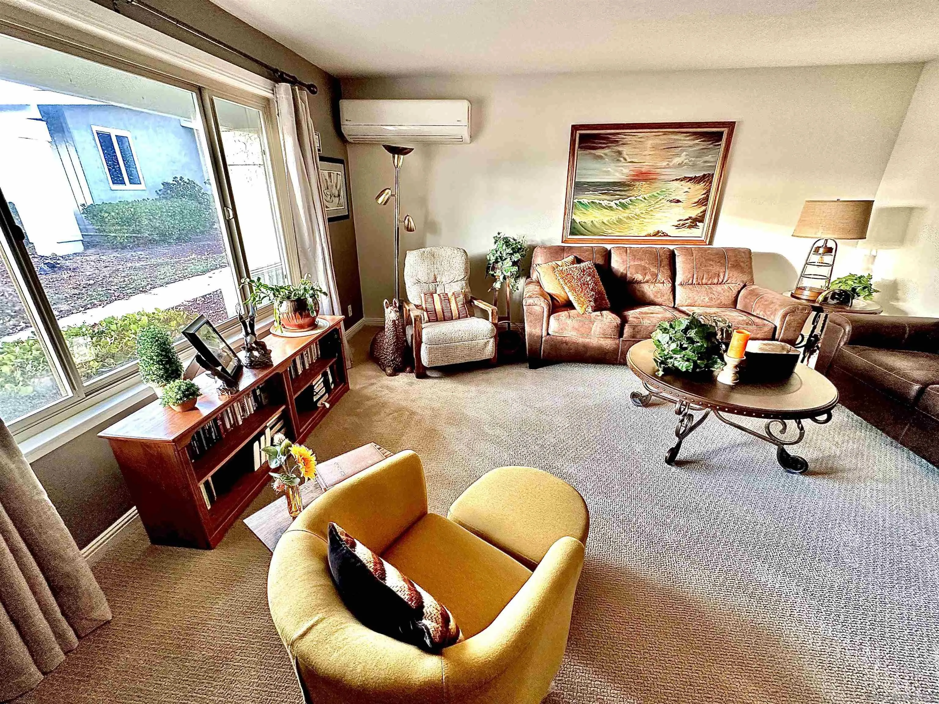 3684 Bartlett Avenue Oceanside, CA 92057 - Photo 8 of 38 a living room with furniture a rug and a large window