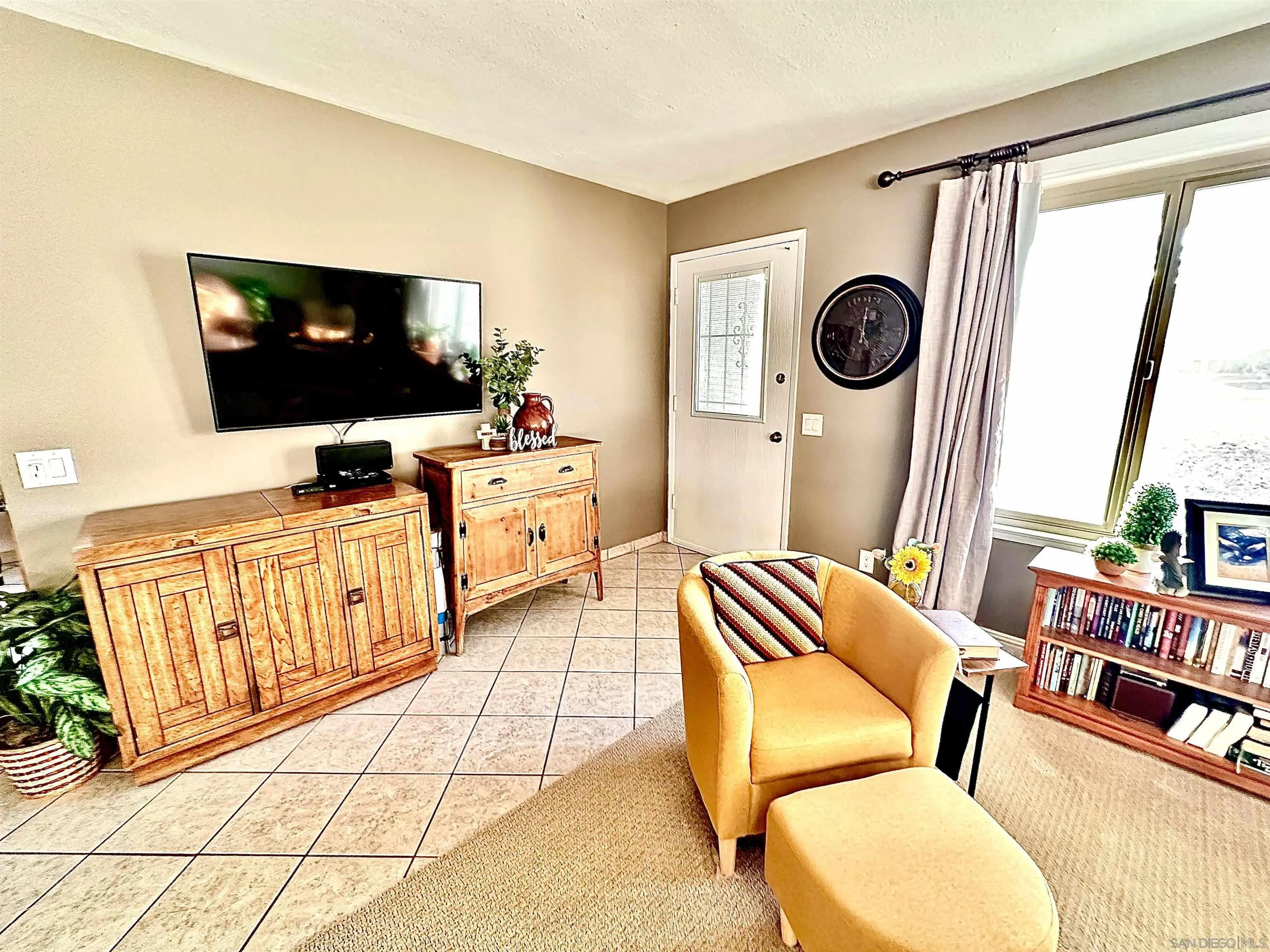 3684 Bartlett Avenue Oceanside, CA 92057 - Photo 9 of 38 a living room with furniture and a flat screen tv