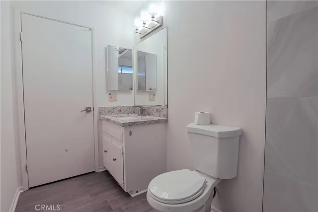a view of a livingroom with a ceiling fan and window