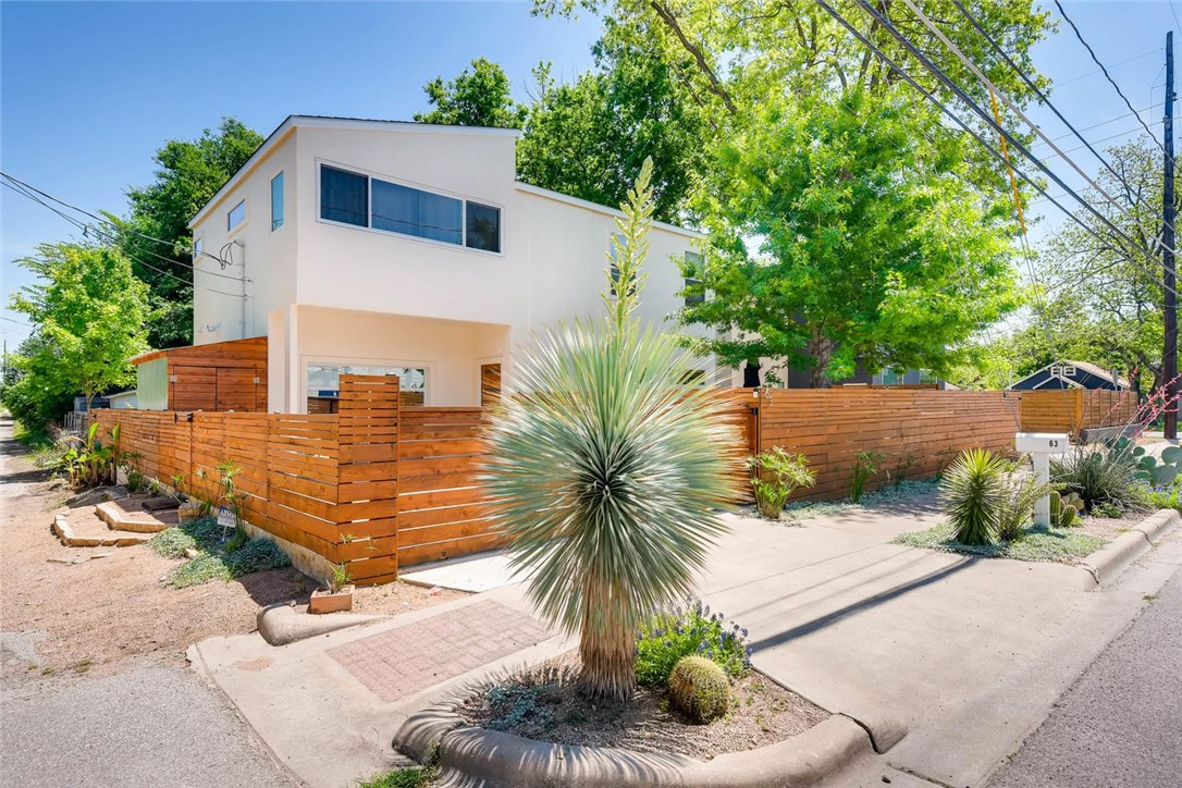 63 Comal Street Austin, TX 78702 - Photo 1 of 1 a house with palm tree in front of it