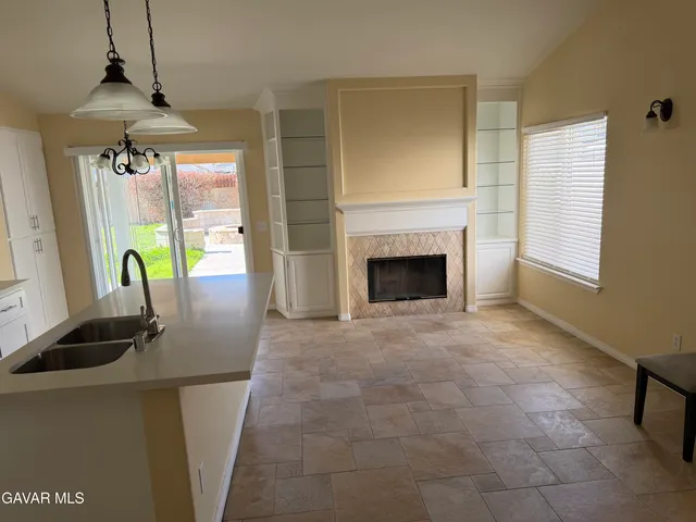 a view of a livingroom with furniture and a fireplace