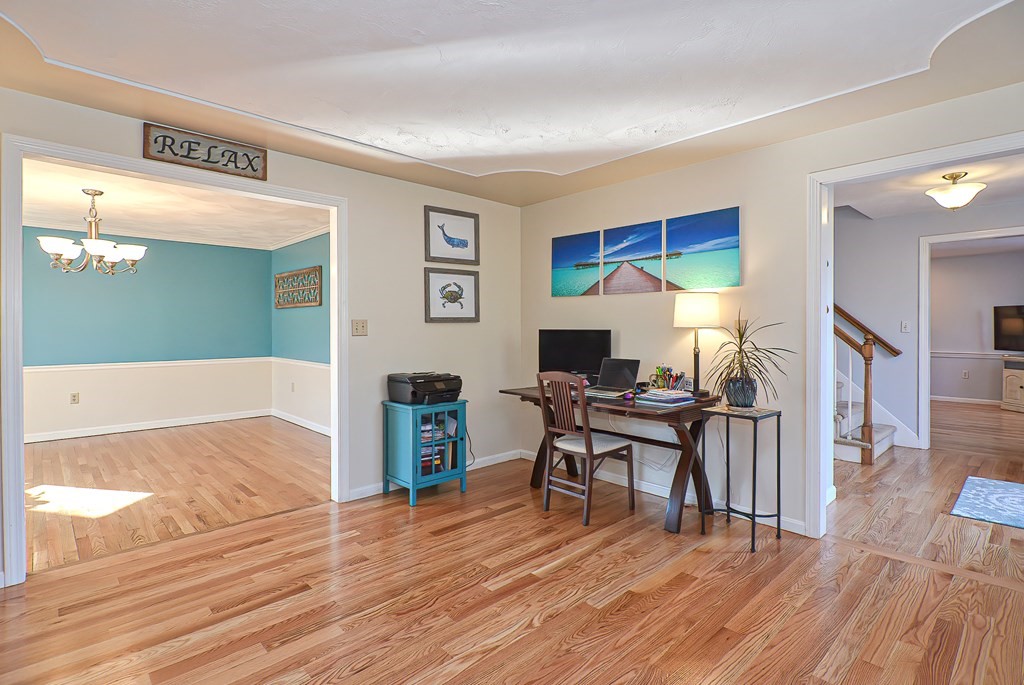3 Jackson Circle Franklin, MA 02038 - Photo 11 of 25 a workspace with wooden floor and furniture