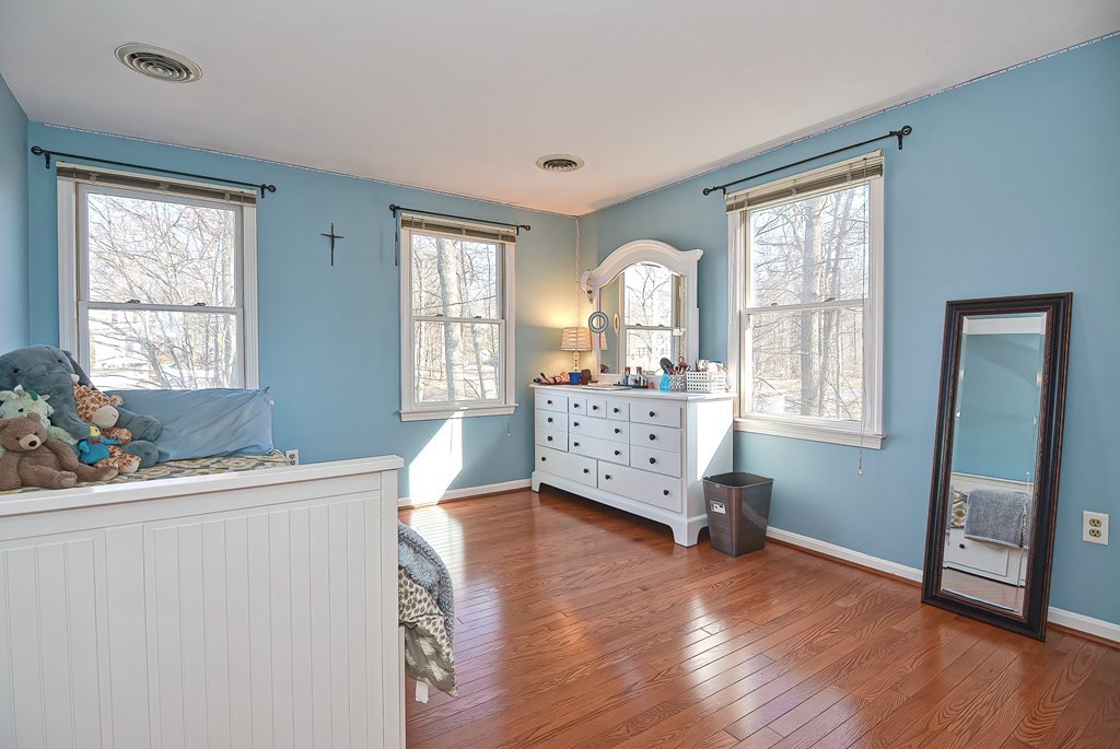 3 Jackson Circle Franklin, MA 02038 - Photo 13 of 25 a living room with furniture and two windows