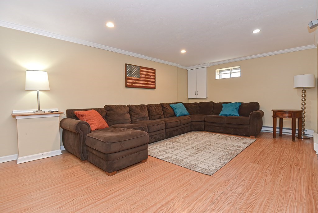 3 Jackson Circle Franklin, MA 02038 - Photo 20 of 25 a living room with furniture and wooden floor