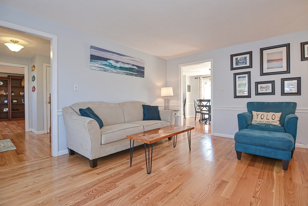 3 Jackson Circle Franklin, MA 02038 - Photo 9 of 25 a living room with furniture and a wooden floor