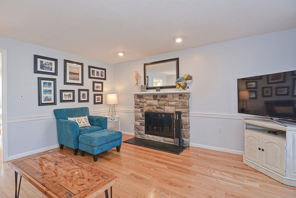 3 Jackson Circle Franklin, MA 02038 - Photo 10 of 25 a living room with furniture and a fireplace