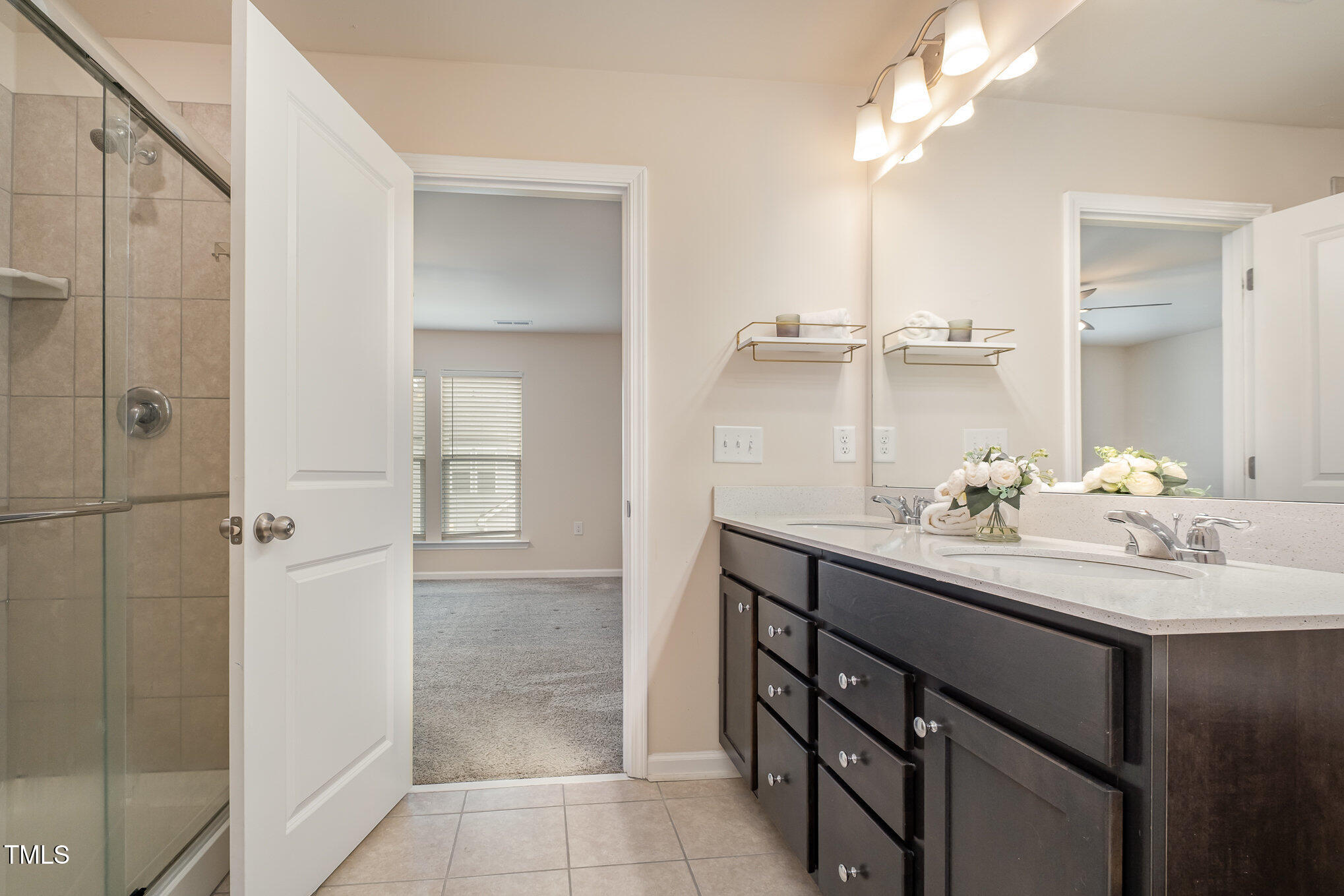 4220 Congleton Place Durham, NC 27703 - Photo 17 of 35 a bathroom with a sink double vanity and a mirror