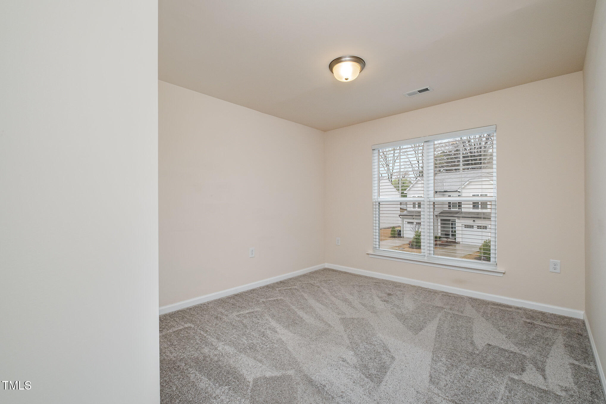 4220 Congleton Place Durham, NC 27703 - Photo 19 of 35 a view of an empty room with a window