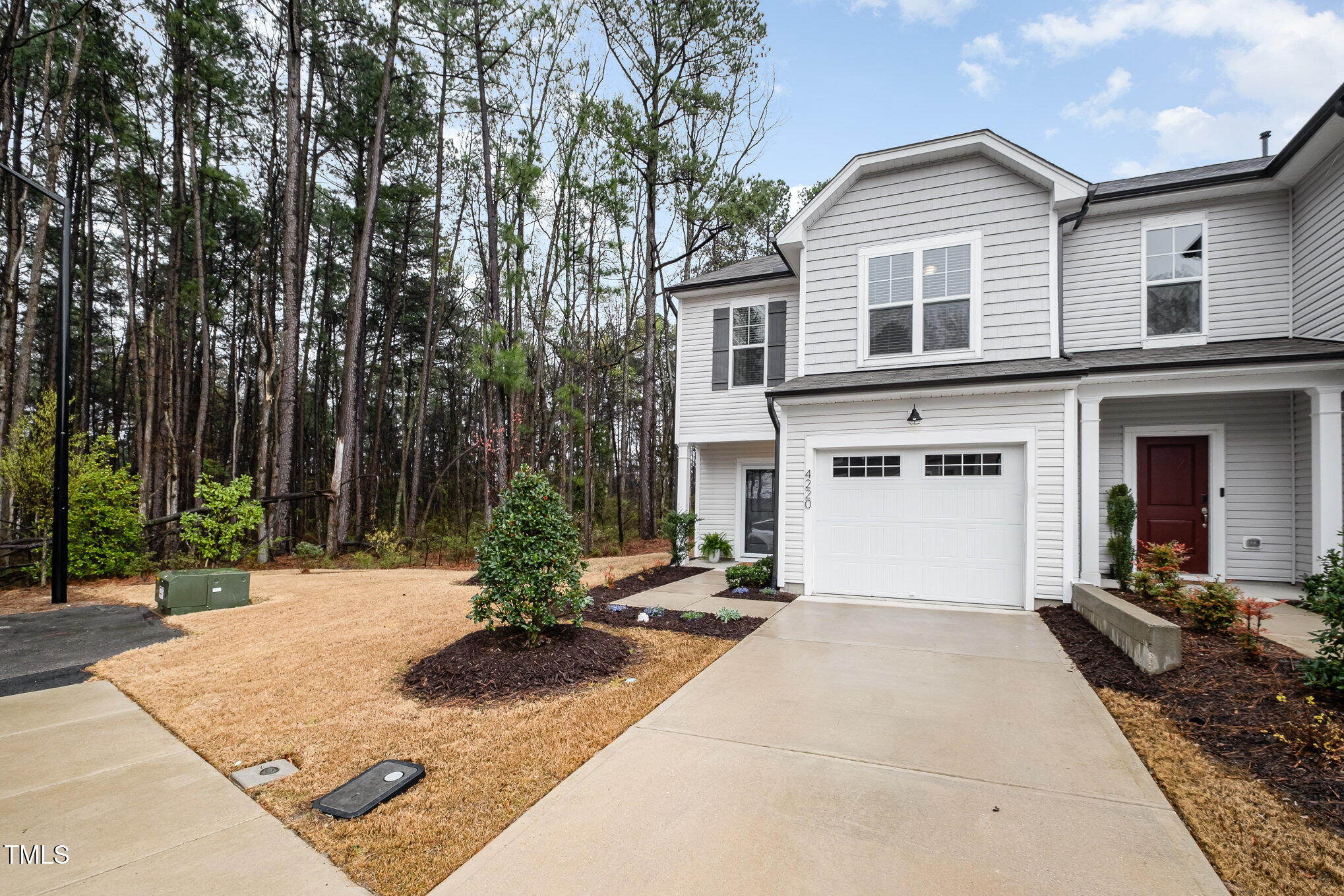 4220 Congleton Place Durham, NC 27703 - Photo 2 of 35 a view of a house with backyard and trees