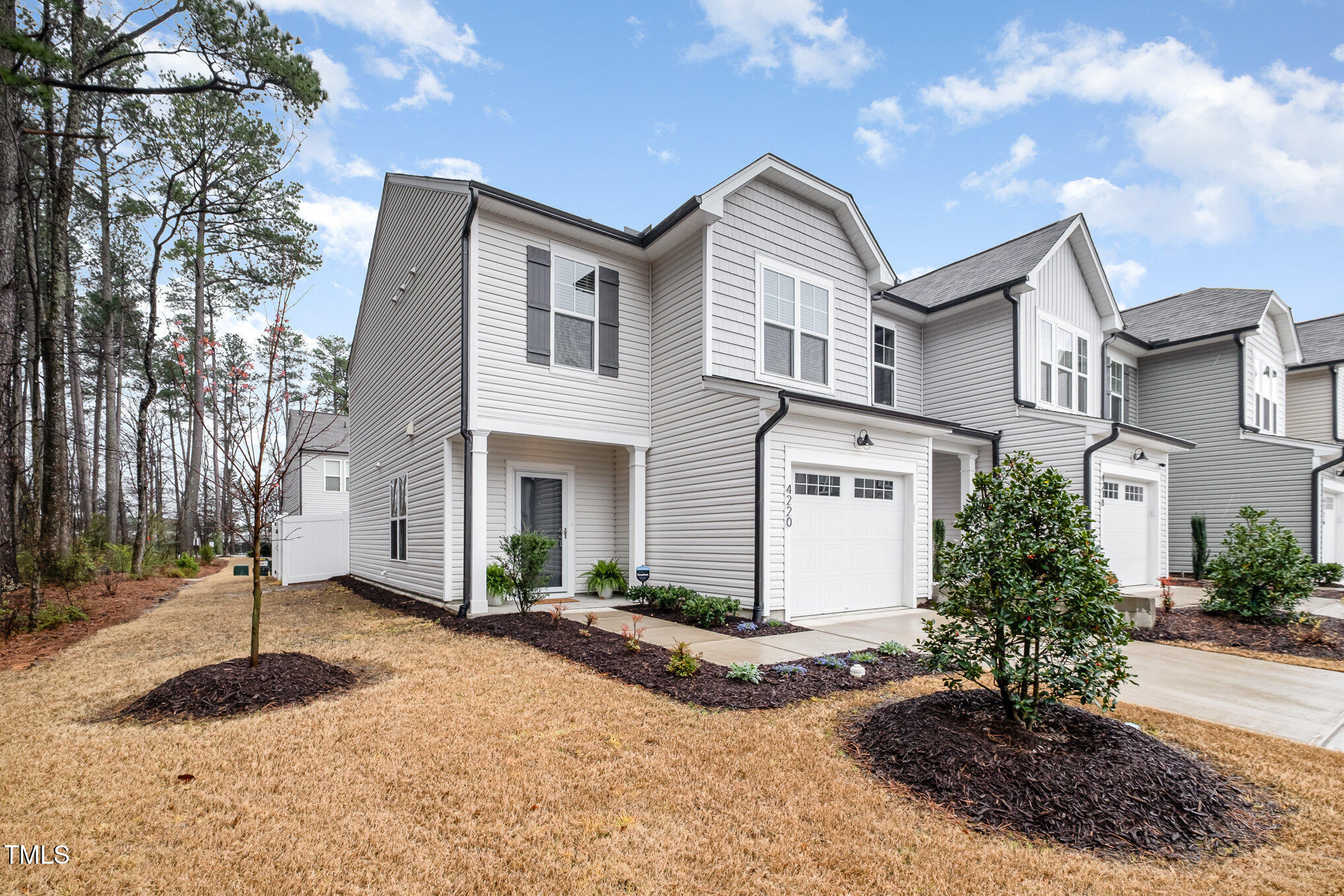 4220 Congleton Place Durham, NC 27703 - Photo 3 of 35 a front view of a house with a yard and garage