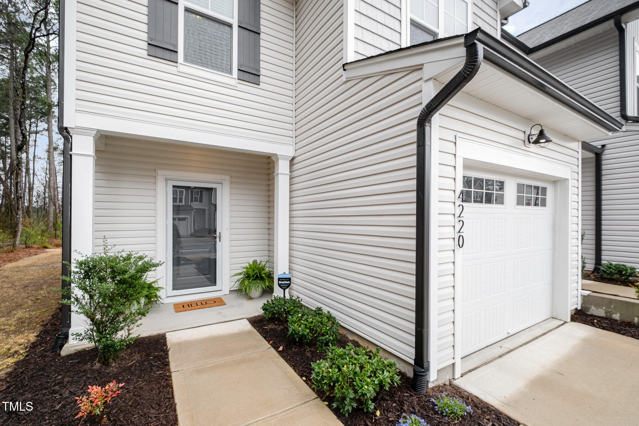 4220 Congleton Place Durham, NC 27703 - Photo 5 of 35 a view of a white house with a small entryway