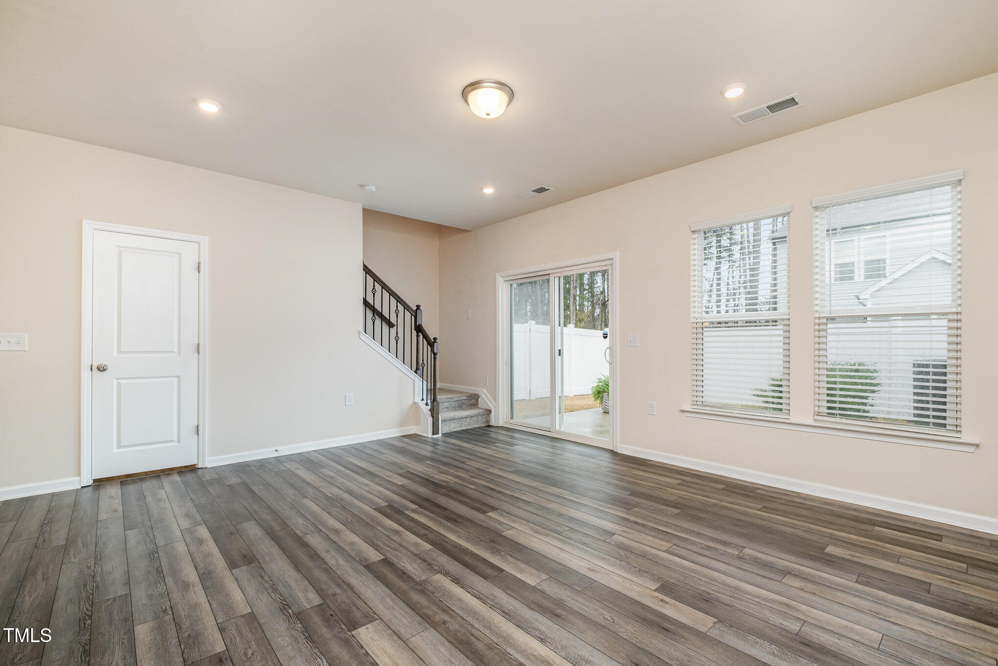 4220 Congleton Place Durham, NC 27703 - Photo 7 of 35 a view of empty room with wooden floor and fan