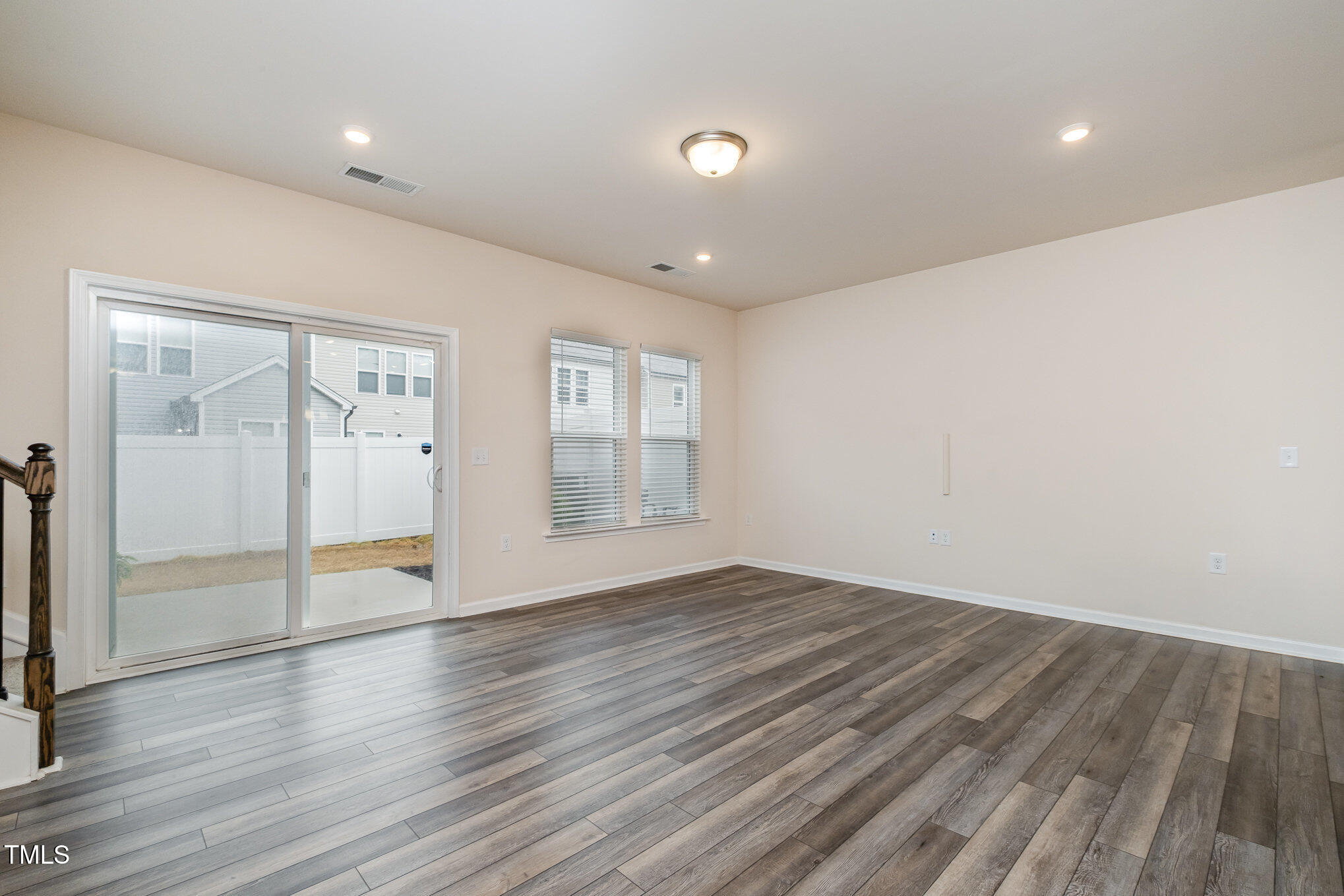 4220 Congleton Place Durham, NC 27703 - Photo 8 of 35 an empty room with wooden floor and windows