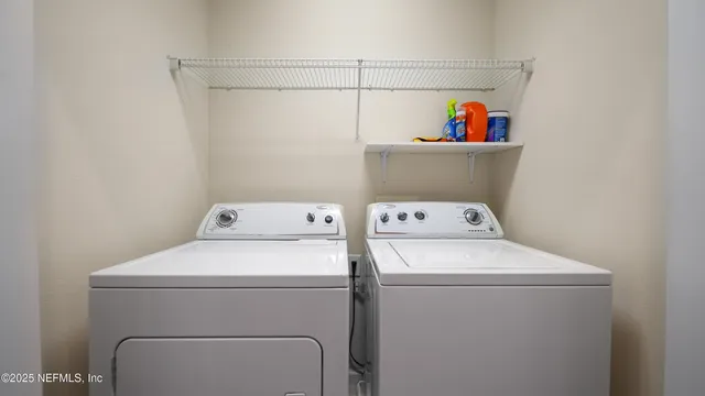 a utility room with dryer and washer