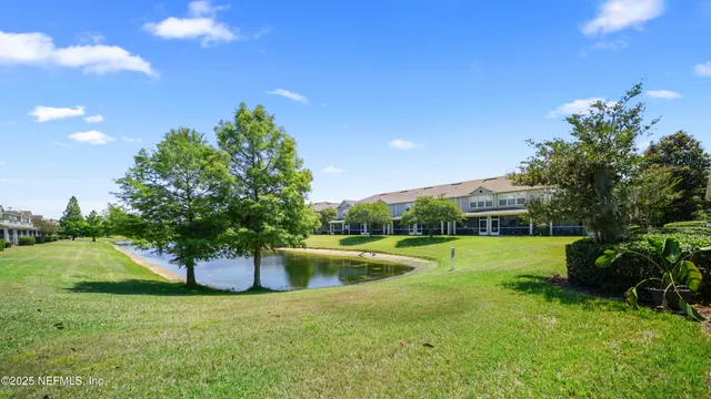 a view of a house with backyard and garden