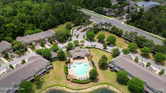an aerial view of a house with a lake view