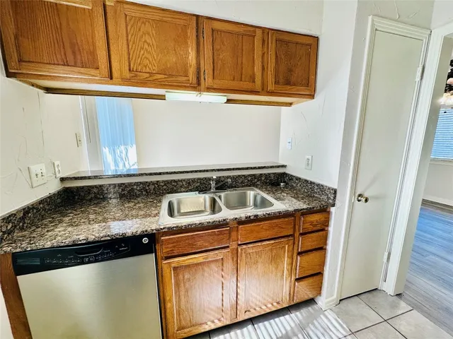 a close view of stove top oven microwave and cabinets