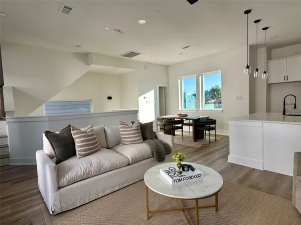 a living room with furniture and a table