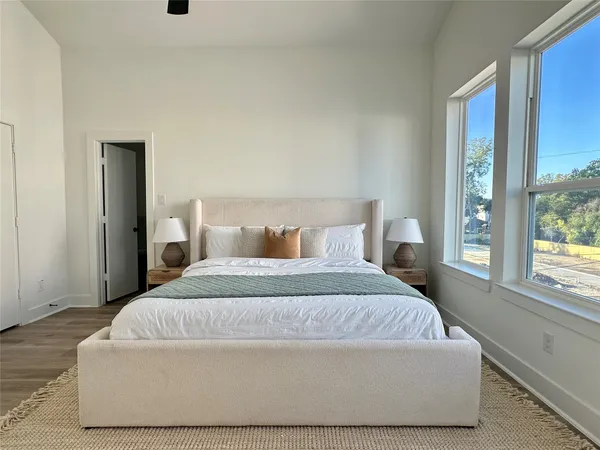 a bedroom with a bed and window