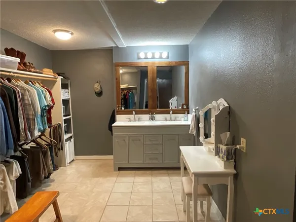 a room with a sink a washer and dryer