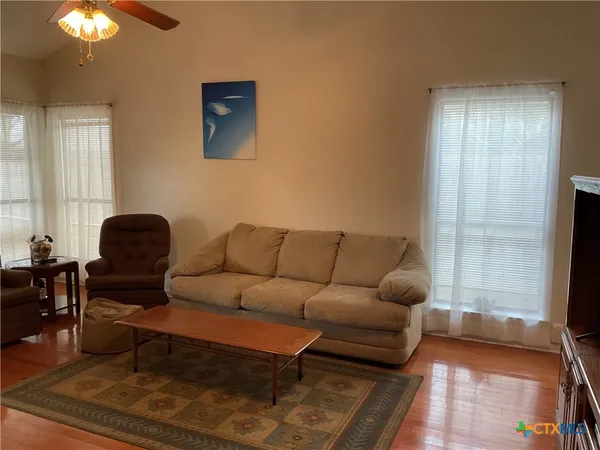 a living room with furniture and a window