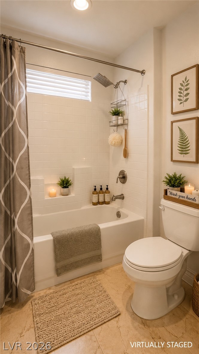 87 Tall Ruff Drive Las Vegas, NV 89148 - Photo 68 of 71 A well-appointed bath with tiled tub surround and practical vanity.