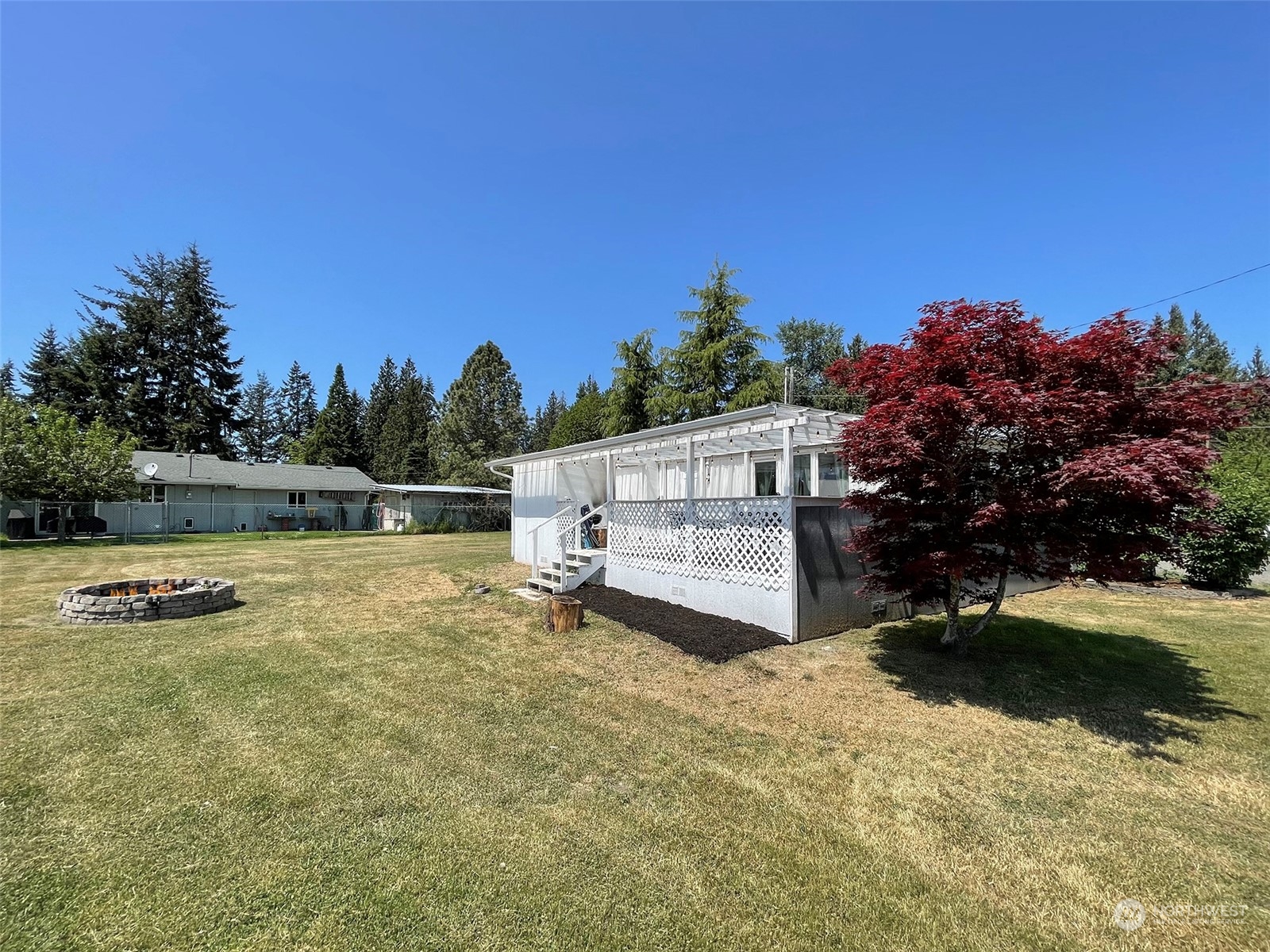 277 House Road Sequim, WA 98382 - Photo 1 of 40 a backyard of a house with lots of green space