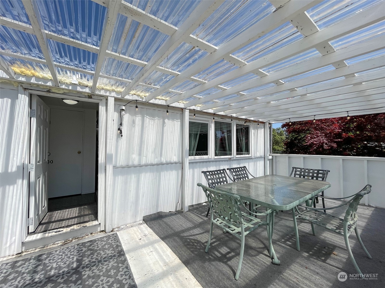 277 House Road Sequim, WA 98382 - Photo 13 of 40 a dinning table and chairs in patio of the house