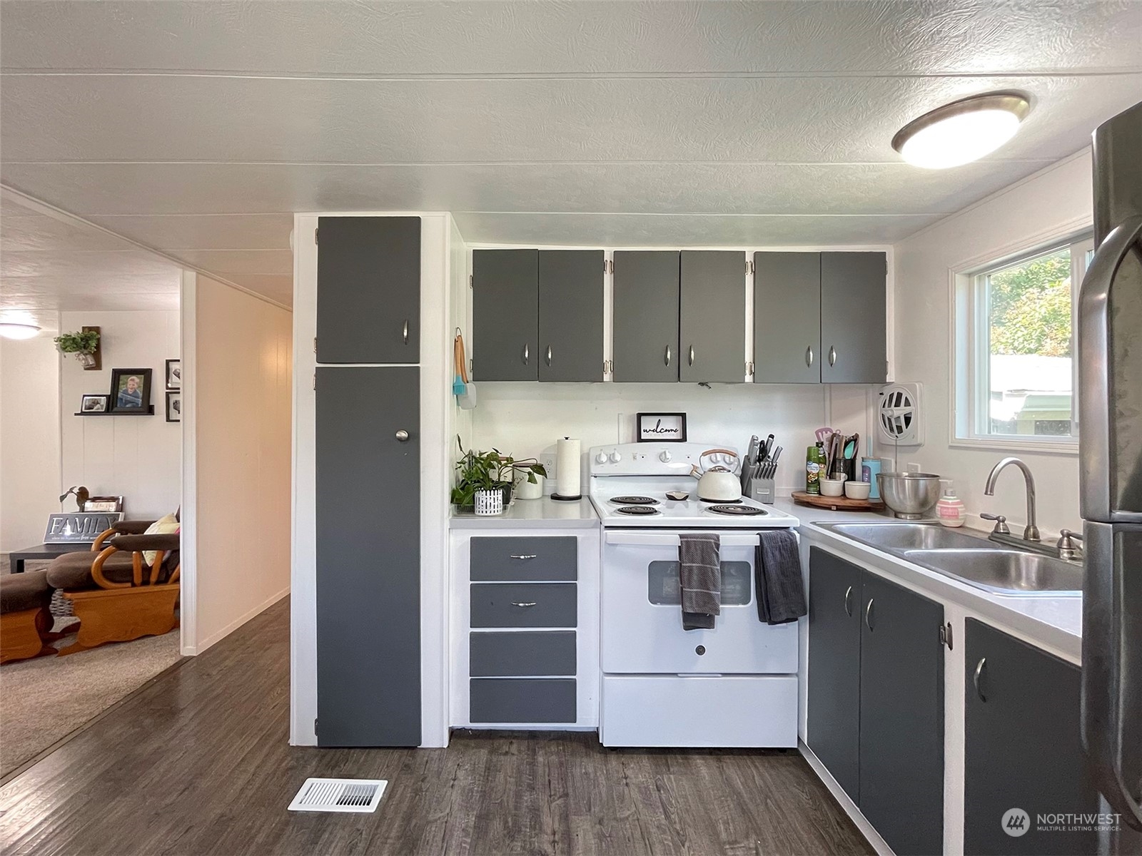 277 House Road Sequim, WA 98382 - Photo 21 of 40 a kitchen with stainless steel appliances granite countertop a stove and a sink
