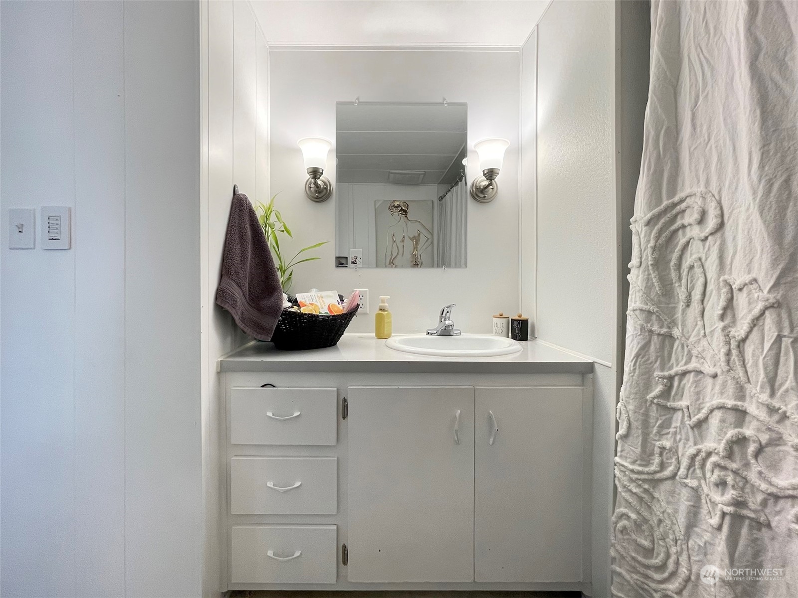 277 House Road Sequim, WA 98382 - Photo 30 of 40 a bathroom with a sink and a mirror