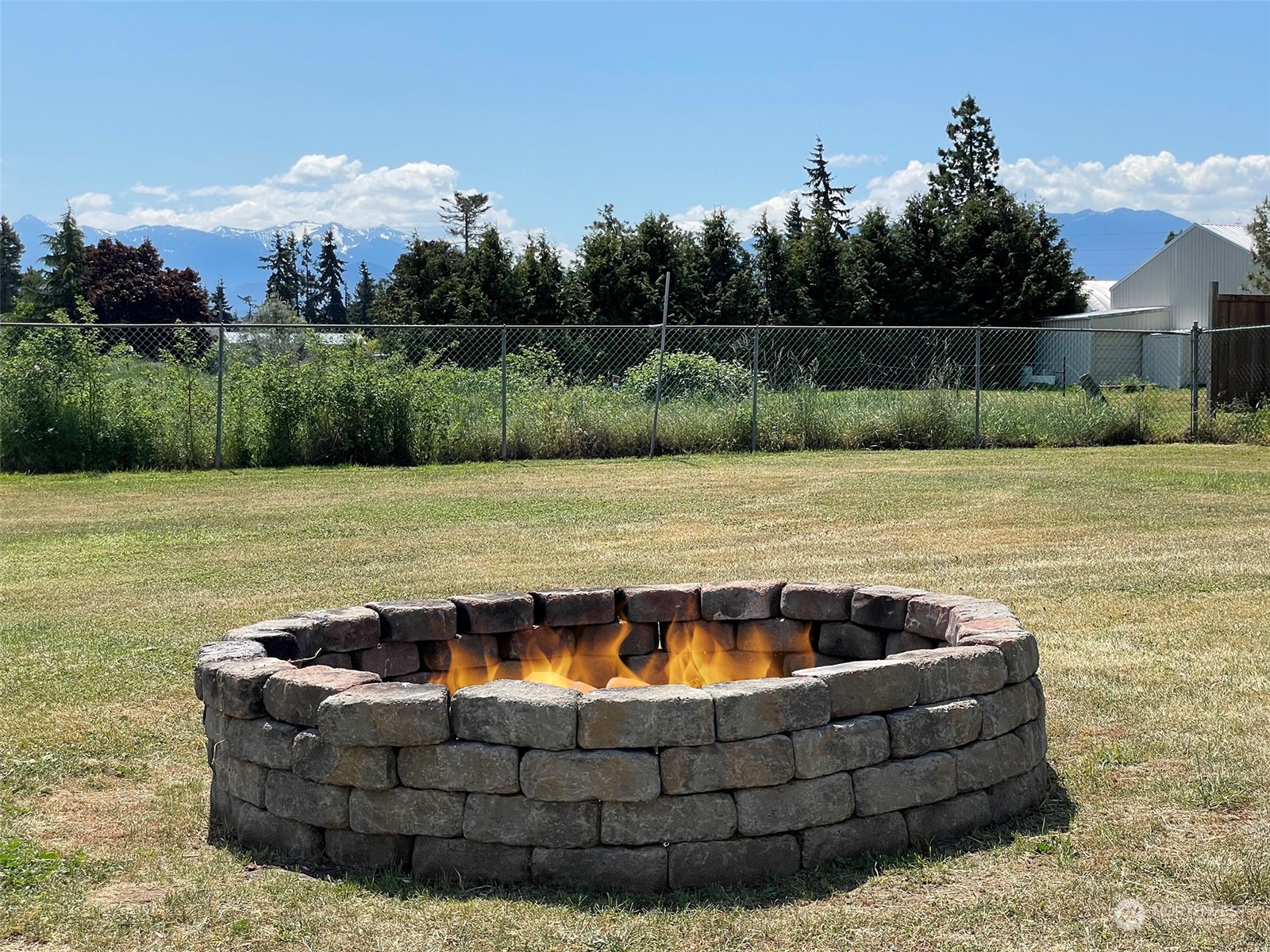 277 House Road Sequim, WA 98382 - Photo 5 of 40 a view of a swimming pool with a yard