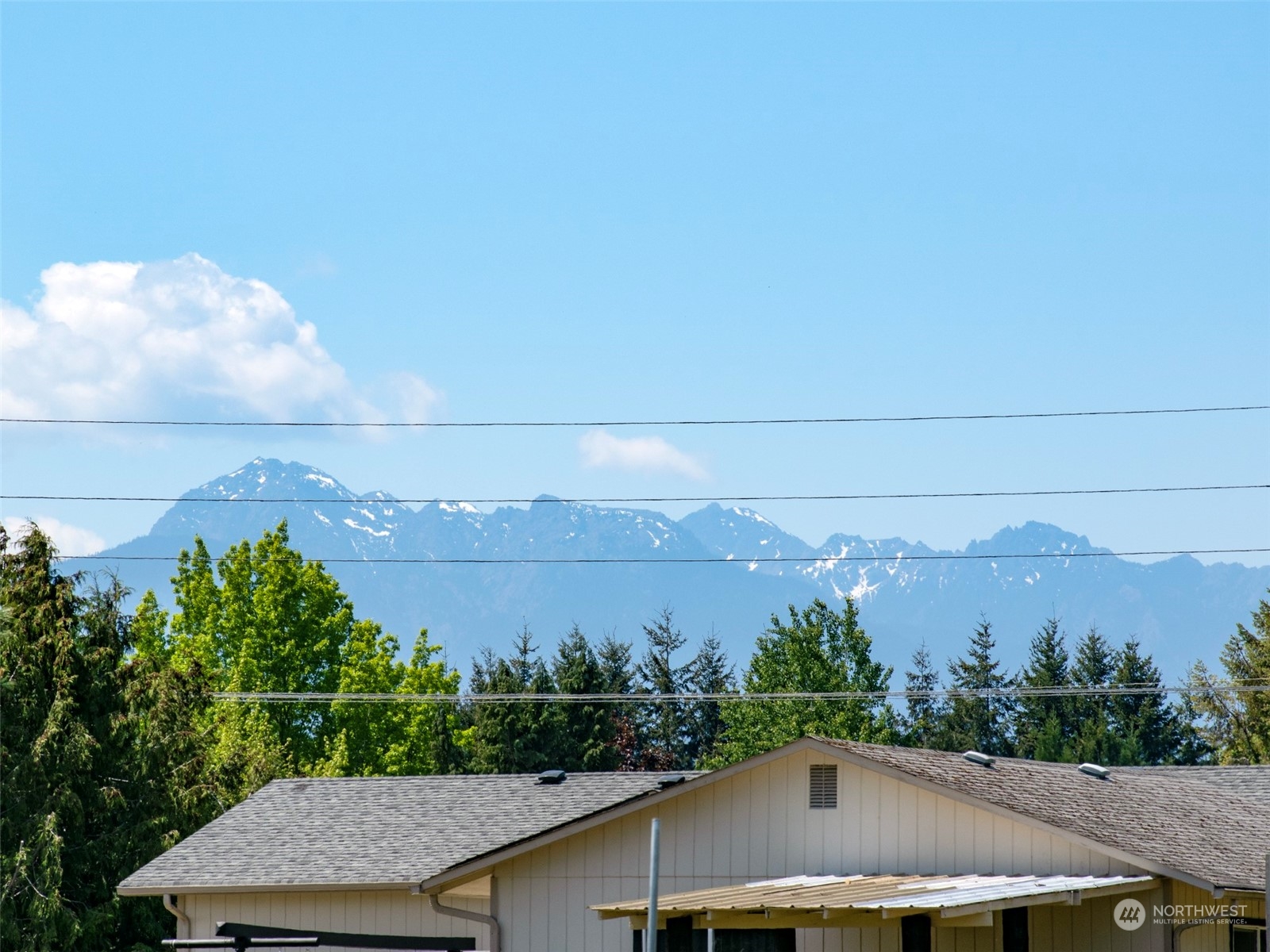 277 House Road Sequim, WA 98382 - Photo 6 of 40 an aerial view of residential houses and trees in the background