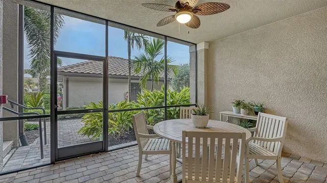 a living room with furniture and a lamp