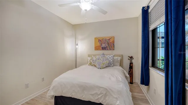 a front view of a house with a garden and plants